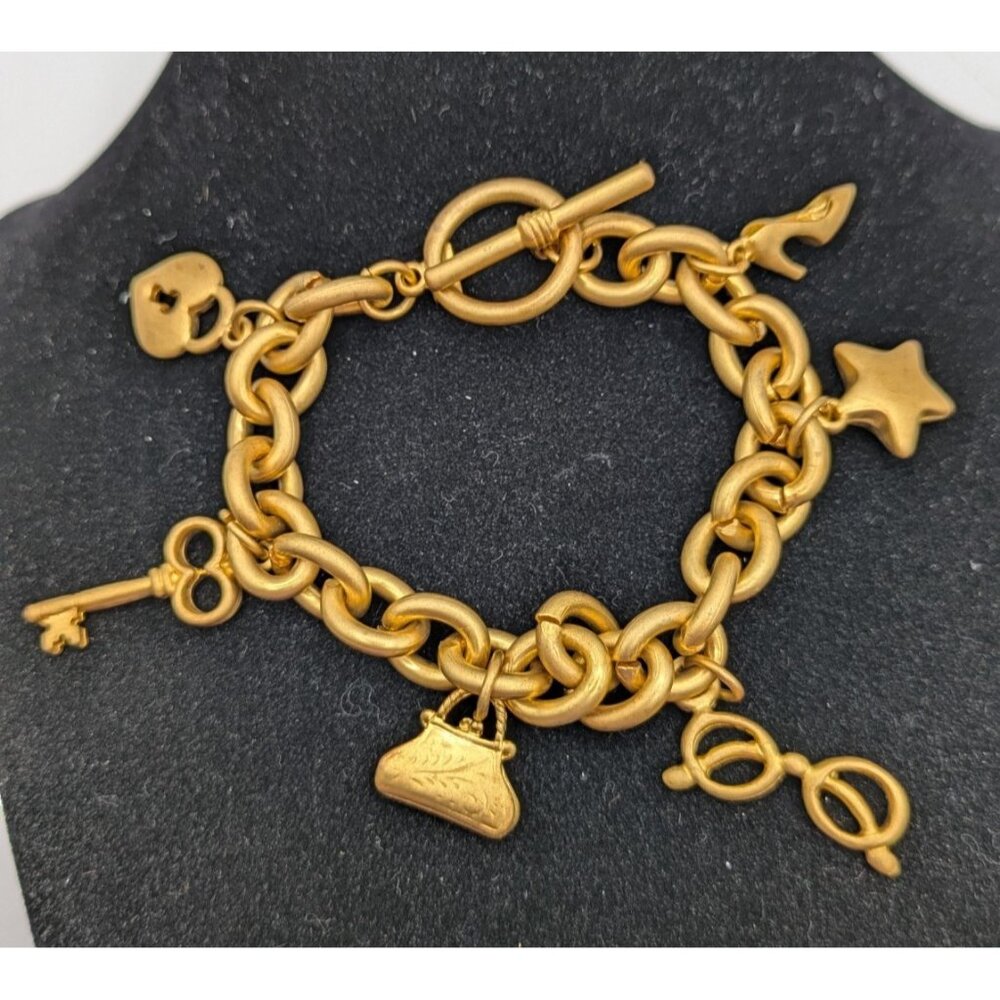 Victorias Secret Signed VS Charm Bracelet Gold Tone Link Chain Toggle Clasp Sz 7